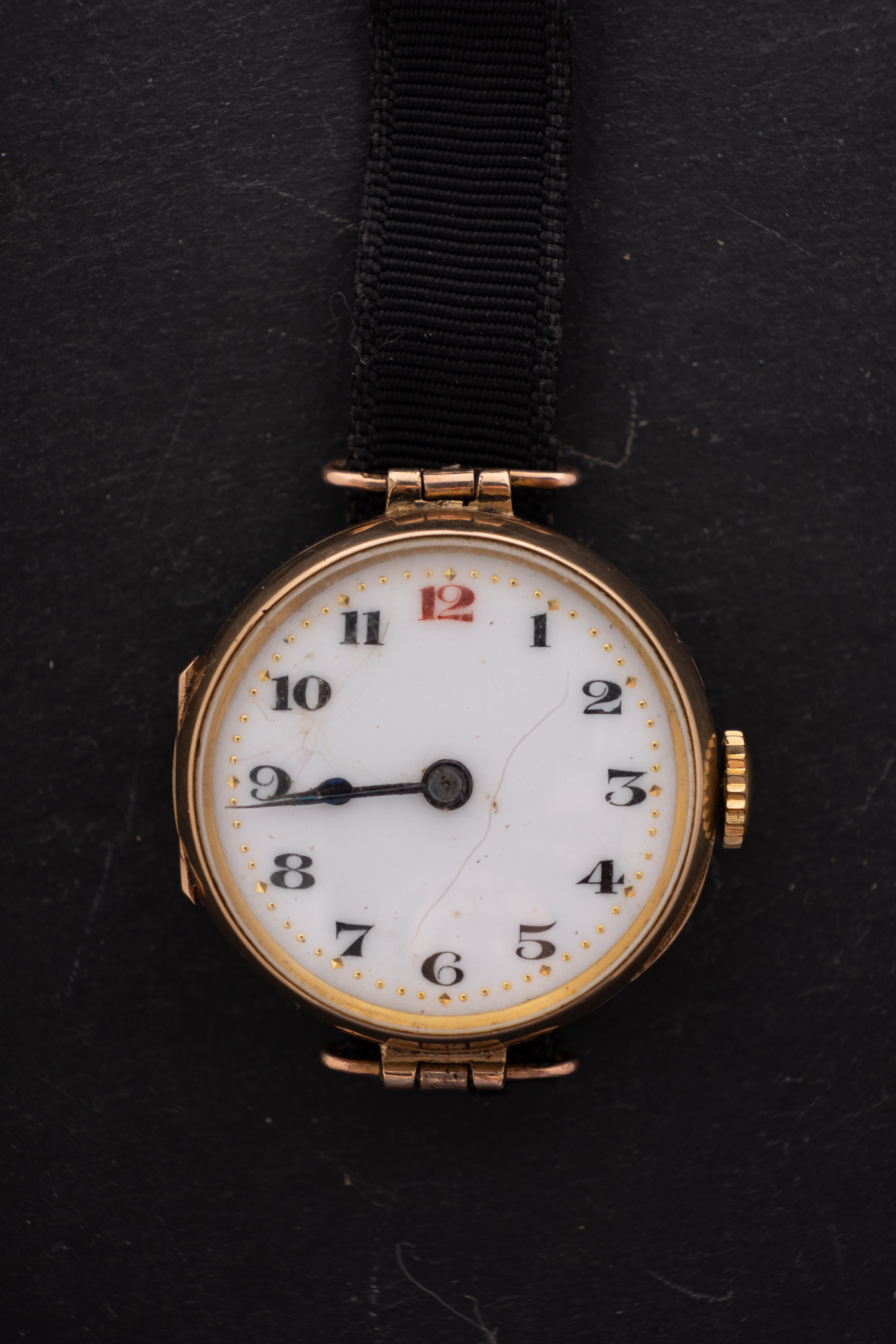 A 9ct gold ladies wristwatch the white dial with black Arabic numerals,