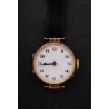 A 9ct gold ladies wristwatch the white dial with black Arabic numerals,