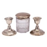 A silver topped glass drum-shaped toilet jar,