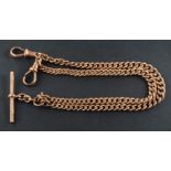 A 9ct gold, graduated, curb-link Albert watch chain, with a dog clip at either end and a T-bar,