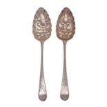 A pair of George III silver and later decorated Old English pattern berry/tablespoons,