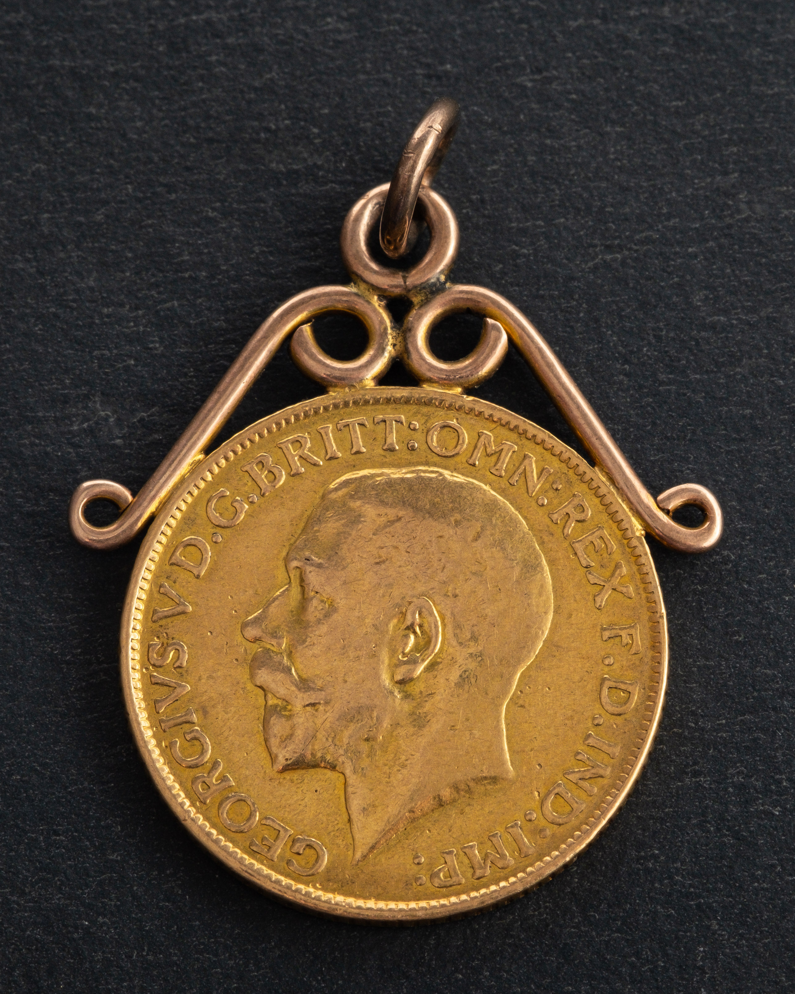 A George V sovereign coin, dated 1914, diameter ca. 22mms, mounted as a pendant, total weight ca. - Image 2 of 2