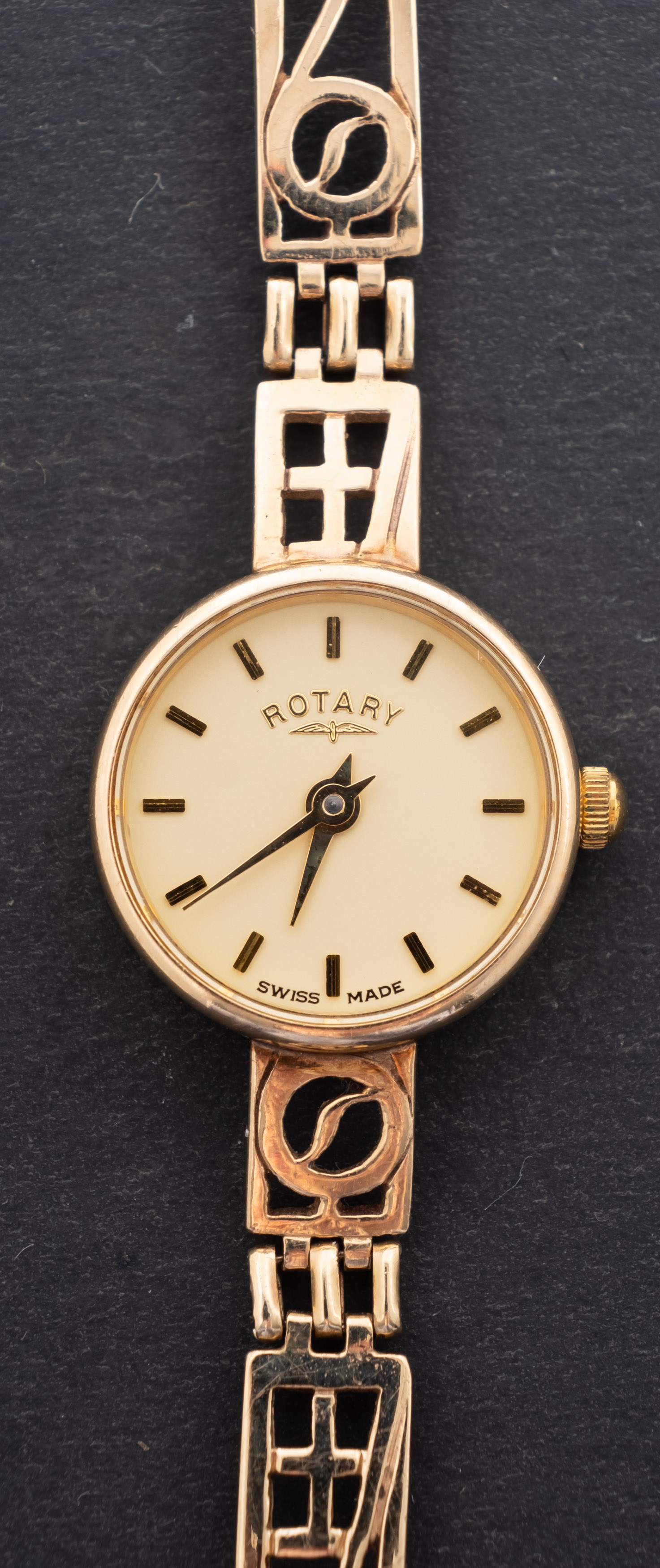 Rotary, a ladies 9ct gold wristwatch the round dial with raised baton numerals and baton hands,