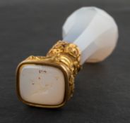 A faceted, banded agate desk seal,