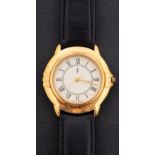 A gold-plated ladies quartz wristwatch signed YSL, for Yves Saint Laurent, on a leather strap,