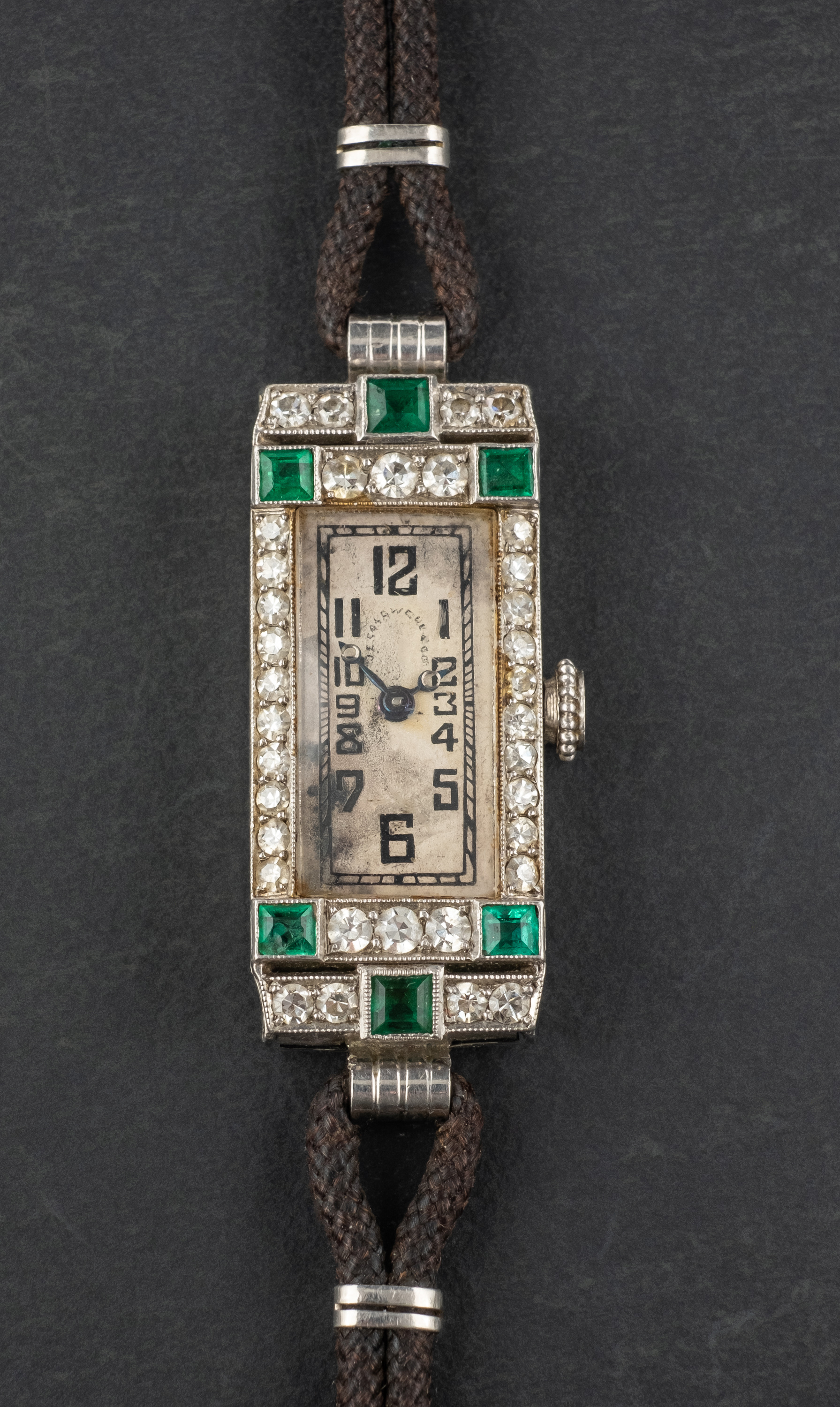 An Art Deco single-cut diamond and carre-cut emerald cocktail watch, total diamond weight ca. 0.