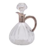 A Continental 835 silver mounted cut glass claret jug of pear-shaped outline with plain mount,