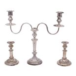 A 19th Century plated twin branch candelabrum with gadrooned rims and reeded scroll arms on a