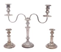 A 19th Century plated twin branch candelabrum with gadrooned rims and reeded scroll arms on a