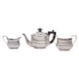 A late Victorian silver bachelors three-piece tea service, makers probably David and John Welby,