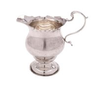 A George V silver pedestal cream jug, maker Wilson & Gill, Birmingham,