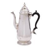 A late Victorian silver coffee pot in the George III manner, makers Goldsmiths & Silversmiths Co.