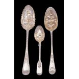 Three various silver berry spoons; George II, George III and Victorian, makers J.