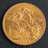 A George V sovereign coin, dated 1913, diameter ca. 22mms, total weight ca. 8gms.