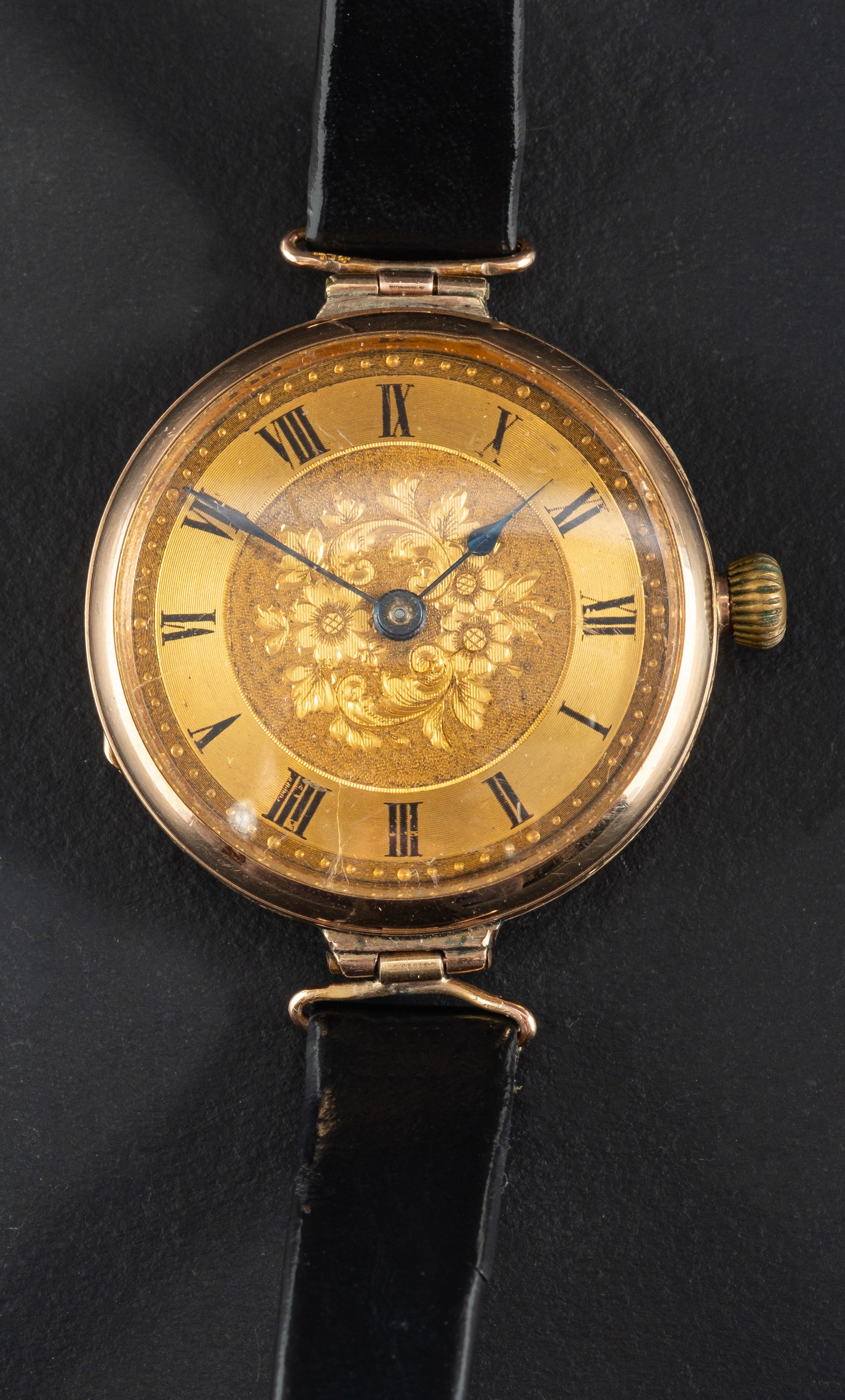 A 9ct gold wristwatch, the gilded dial with Roman numerals on engraved floral background, - Image 2 of 2