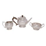 A George V silver three-piece tea service, makers Crichton Brothers, London 1929 of globular shape,