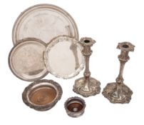 A quantity of silver plate to include: a pair of rococo candlesticks,