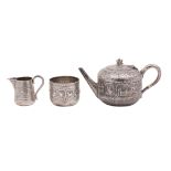 A Victorian silver three-piece tea service in the Indian manner, maker Hamilton & Inches,