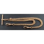 A 9ct gold, graduated, curb-link Albert watch chain, with dog clips at either end and a T-bar,