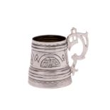 A Russian silver cup, maker Viktor Savinkov, Moscow 1873 of tapered tankard form with reeded bands,