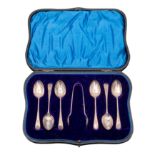 A set of six George V silver tea spoons and tongs, maker Henry Atkin, Sheffield,