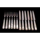 A set of six Edward VII silver and mother of pearl handled dessert knives and six matching forks,