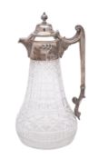 A silver plate mounted cut-glass claret jug: of pear-shaped outline ,