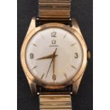 Omega, a gentleman's gold wristwatch the round cream dial with raised baton and Arabic numerals,