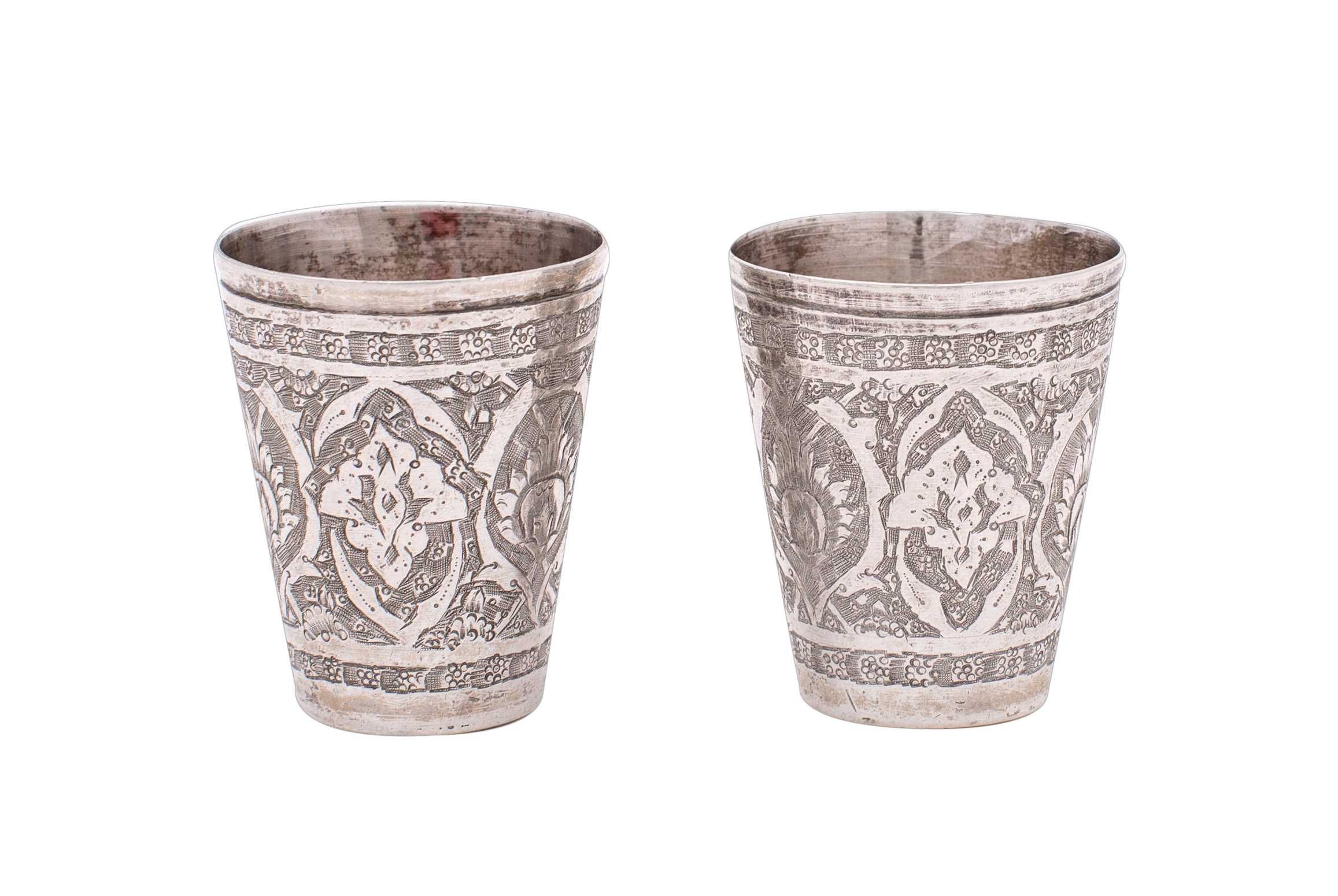 Two Persian silver tots of cylindrical tapering outline, with chased foliate decoration, 4. - Image 2 of 2