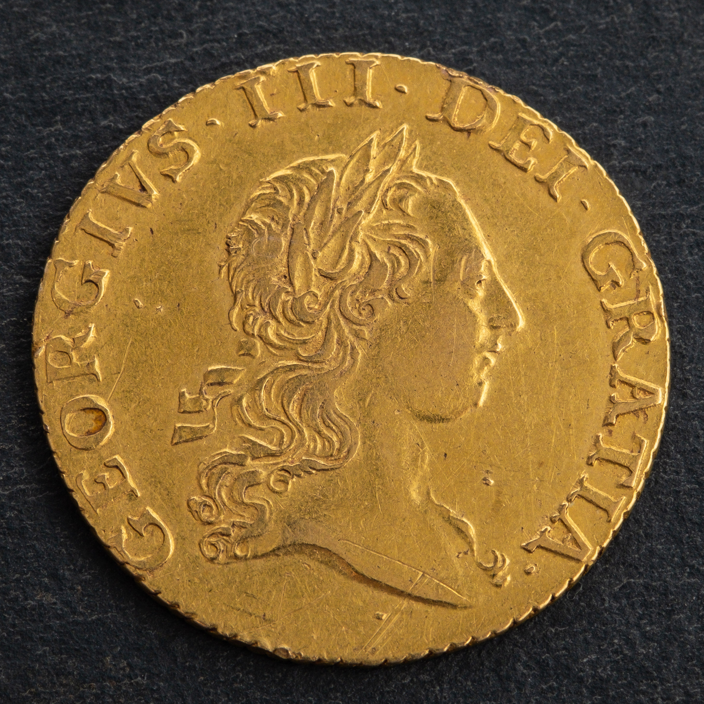 A George III Sovereign coin, dated 1704, diameter ca. 20.5mms, total weight ca. 4.1gms. - Image 2 of 2