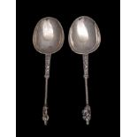 A pair of 19th Century Continental silver apostle spoons with plain oval bowls and handles with