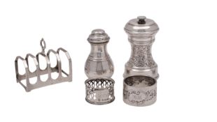 A pair of George VI silver peppers, makers William Comyns & Sons Ltd, London 1947 8cm high,