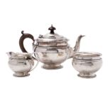 A George V silver three-piece pedestal tea service, makers Mappin & Webb,