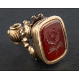 A carnelian fob engraved with a thistle motif, total length ca. 2.5cm, total weight ca. 7.1gms.