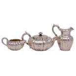 A Victorian silver three-piece tea service of Chinese influence, makers John Tapley & Co,