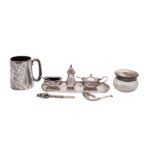 An assortment of silver items to include: a silver lidded glass bodied dressing table jar with hand