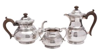 A George VI silver three-piece tea-service, makers Mappin and Webb, London 1939, with inscription,