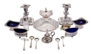 A pair of early 19th Century plated navette-shaped salts with pierced decoration and blue glass