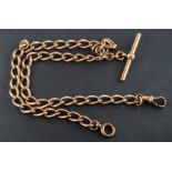 A curb-link Albert watch chain, with T-bar and dog clip, stamped '9', total length ca. 39.