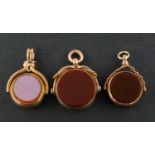 Three swivel fobs, including two 9ct gold,