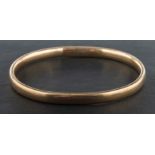 A bangle, stamped '9CT', inner diameter ca. 6.7cm, total weight ca. 37.7gms.