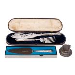 A silver handled fish serving knife and fork with plated blade and tines,