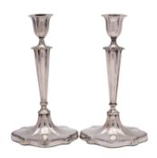 A pair of Edward VII silver candlesticks, makers Walker & Hall, Chester, date letters worn,