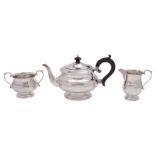 A George V silver three-piece tea service, makers Roberts & Dore Ltd,