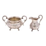 A Victorian silver circular twin-handled sugar basin and matching pear-shaped cream jug,