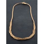 A textured, three-row, omega-link necklace, stamped '9K', total length ca. 42cm, total weight ca 21.