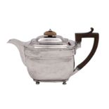 A George III silver teapot, maker John Emes, London 1806 of barge-shaped outline,