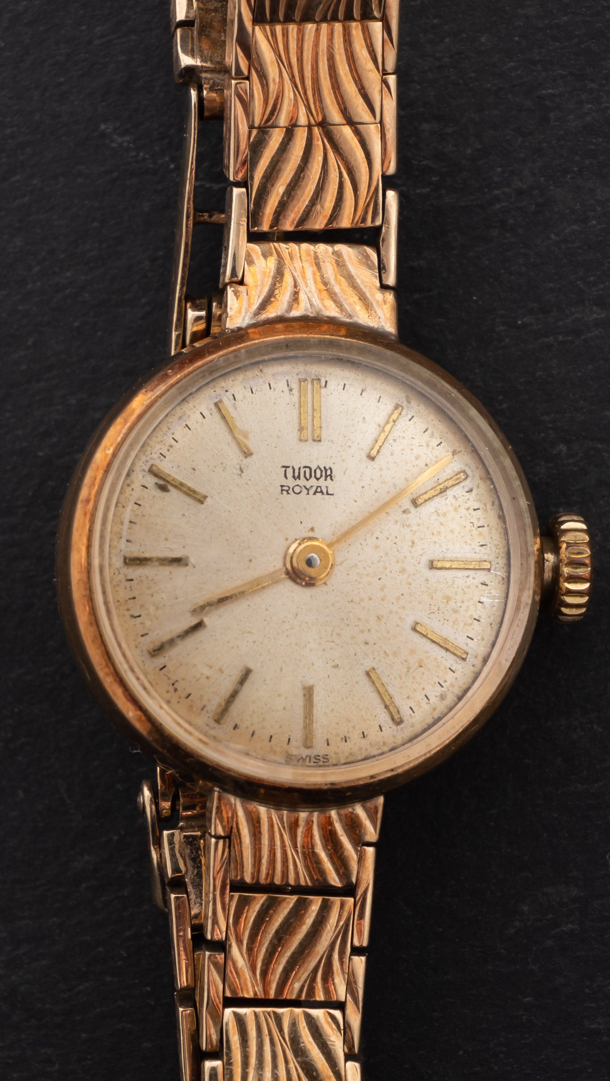 Tudor, a gold dress watch the silvered dial with raised baton numerals,