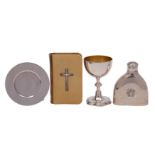 A silver travelling communion set comprising: a Gothic style chalice, with petal base,