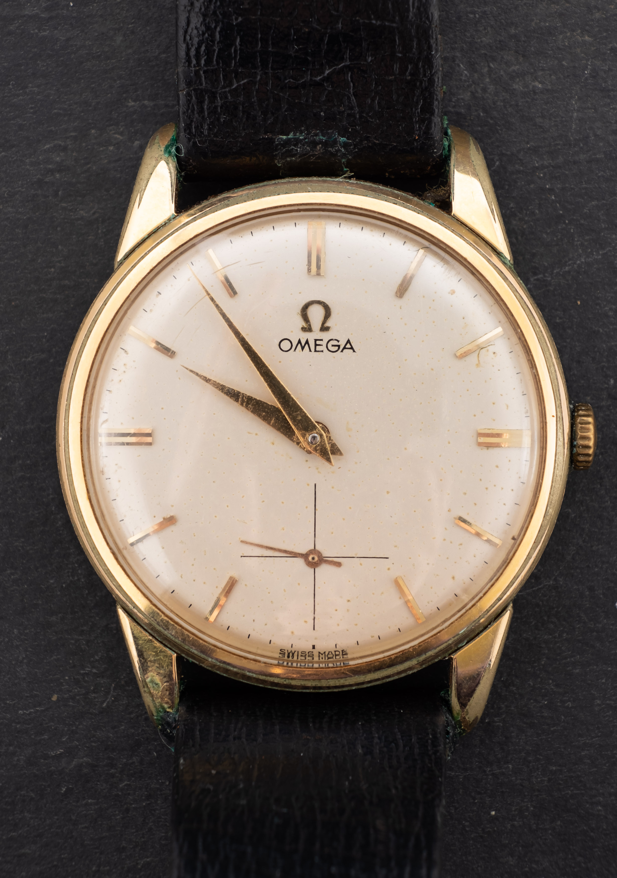 Omega, a gentleman's gold-plated wristwatch the cream dial with raised gold baton numerals,